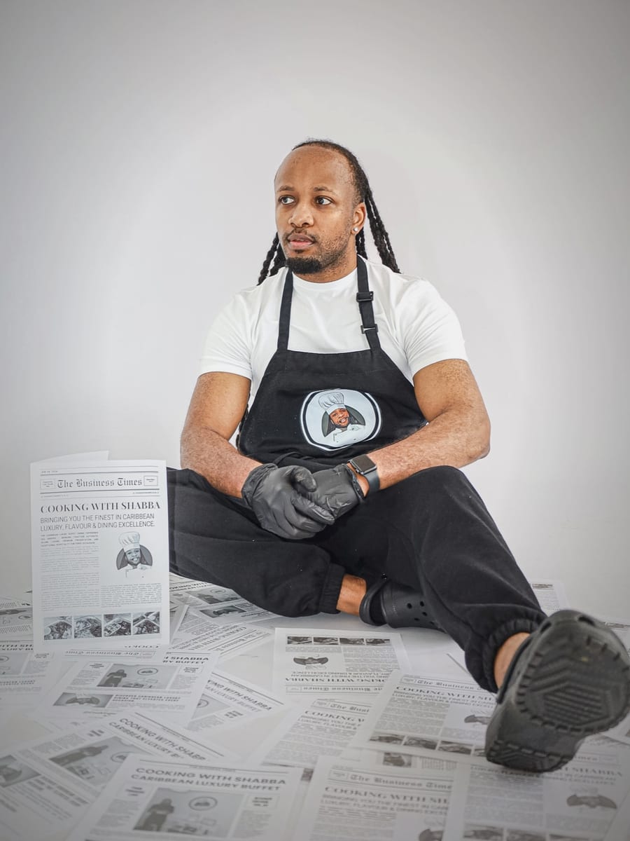 Shabba — the chef behind Cooking with Shabba, in his branded apron